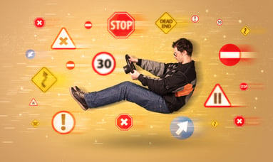 Young driver with road signs around him concept